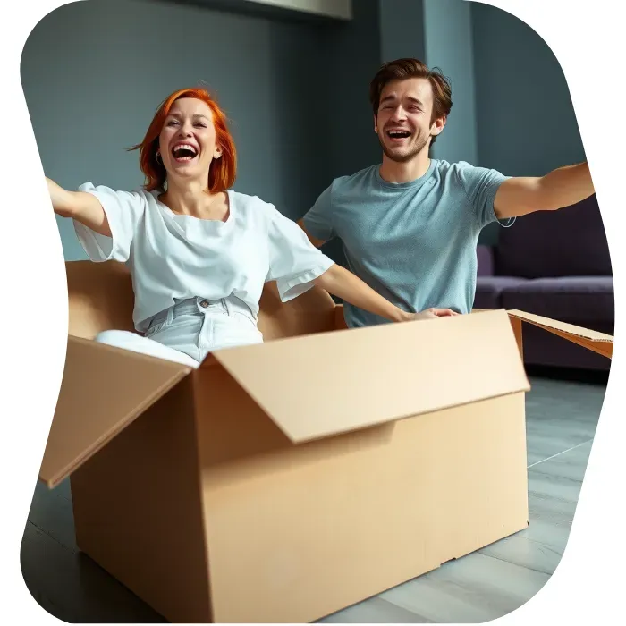 Two guys sitting on the floor of their apartment with Muval moving boxes